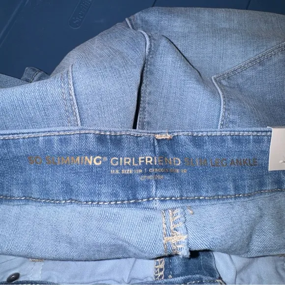 Chico’s So Slimming Lace-Up Hem Girlfriend Ankle Jeans.