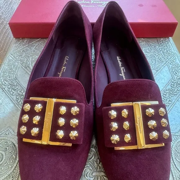 Ferragamo flats in plum suede and gold hardware. Size 8.5