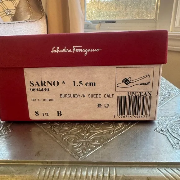Ferragamo flats in plum suede and gold hardware. Size 8.5