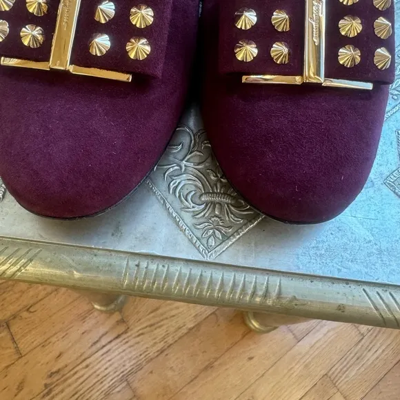 Ferragamo flats in plum suede and gold hardware. Size 8.5