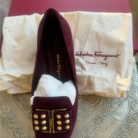 Ferragamo flats in plum suede and gold hardware. Size 8.5