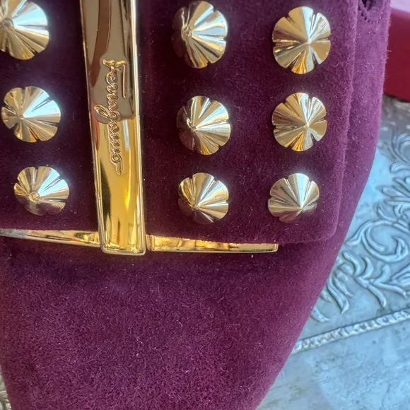 Ferragamo flats in plum suede and gold hardware. Size 8.5