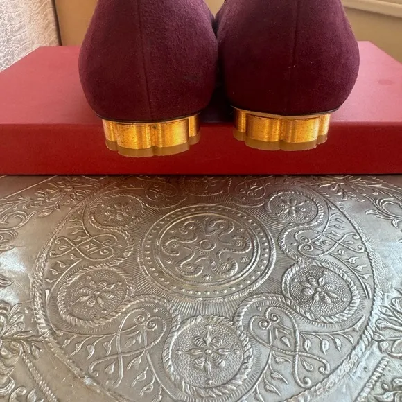 Ferragamo flats in plum suede and gold hardware. Size 8.5