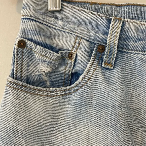 Levi’s 501 Distressed Light Wash Denim Jeans straight leg raw hem