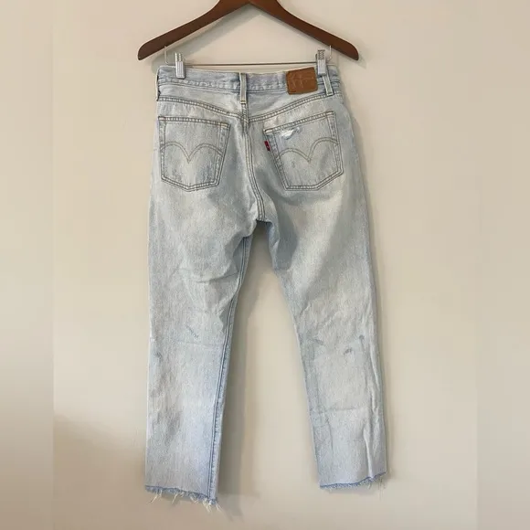 Levi’s 501 Distressed Light Wash Denim Jeans straight leg raw hem