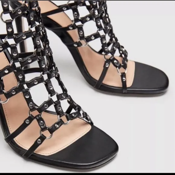 Zara black leather caged heeled sandals.