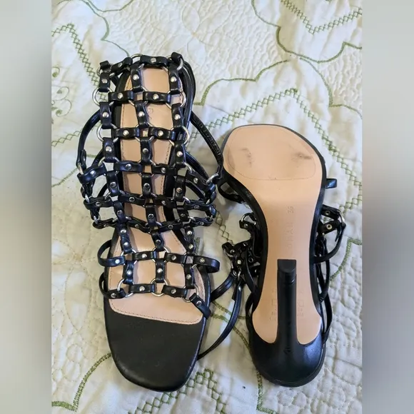 Zara black leather caged heeled sandals.