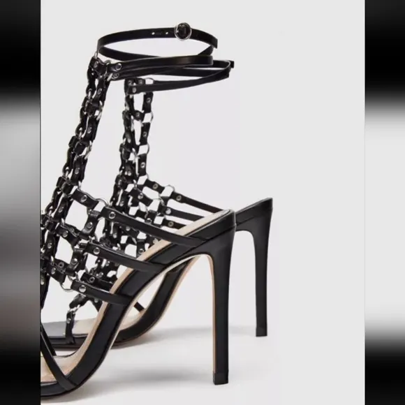 Zara black leather caged heeled sandals.