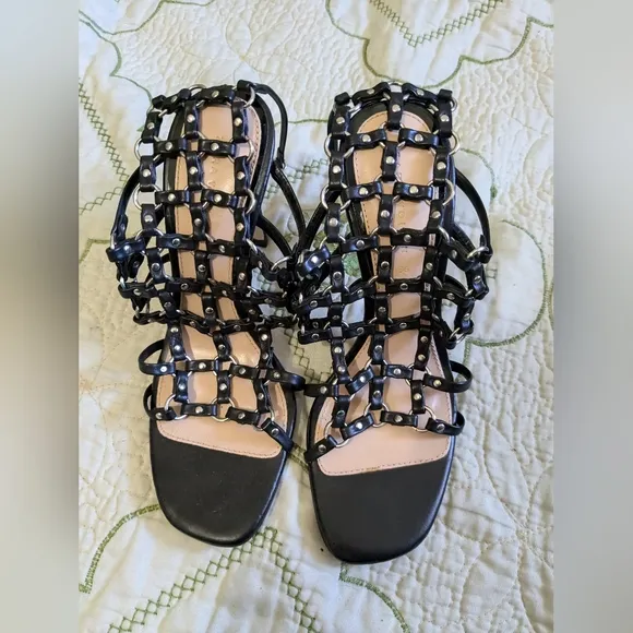 Zara black leather caged heeled sandals.