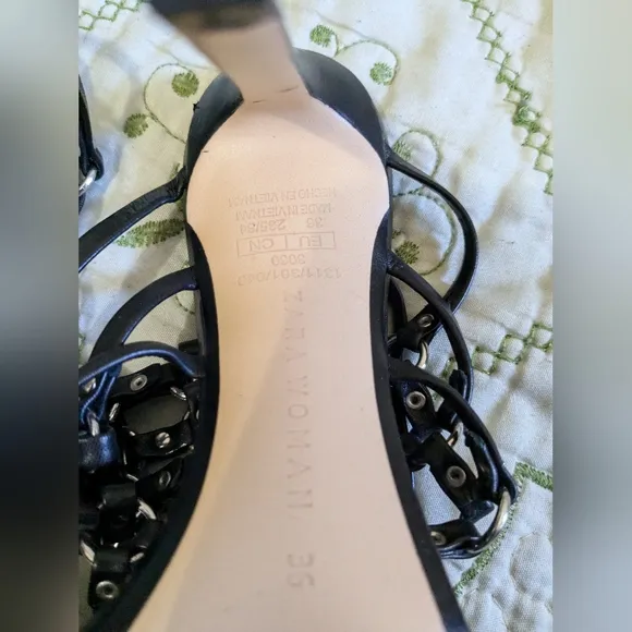 Zara black leather caged heeled sandals.