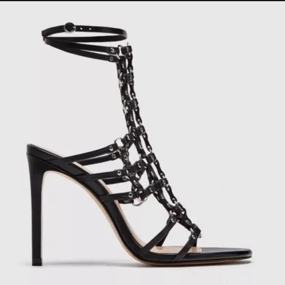 Zara black leather caged heeled sandals.